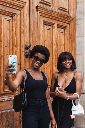 black-females-taking-selfie-with-smartphones-while-2024-05-13-16-36-06-utc
